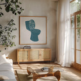 Turkish Tile Bathroom Puns IV by Becky Thorns. Shown in a natural wood frame in a cozy modern living room. Available as an archival giclee rolled canvas, fine art paper, or poster print. SKU 58434a.