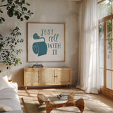 Turkish Tile Bathroom Puns V by Becky Thorns. Shown in a natural wood frame in a cozy modern living room. Available as an archival giclee rolled canvas, fine art paper, or poster print. SKU 58435a.