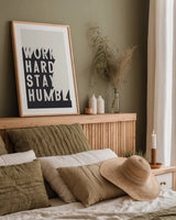 Work Hard Stay Humble BW by Becky Thorns. shown as a paper print in a natural frame. Available as a archival giclee rolled canvas, fine art paper, or poster print. SKU 59634h.