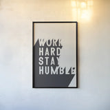 Work Hard Stay Humble BW by Becky Thorns. shown as a paper print in a black flame. Available as a archival giclee rolled canvas, fine art paper, or poster print. SKU 59634h.