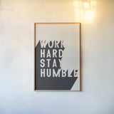 Work Hard Stay Humble BW by Becky Thorns. shown as a paper print in a natural frame. Available as a archival giclee rolled canvas, fine art paper, or poster print. SKU 59634h.