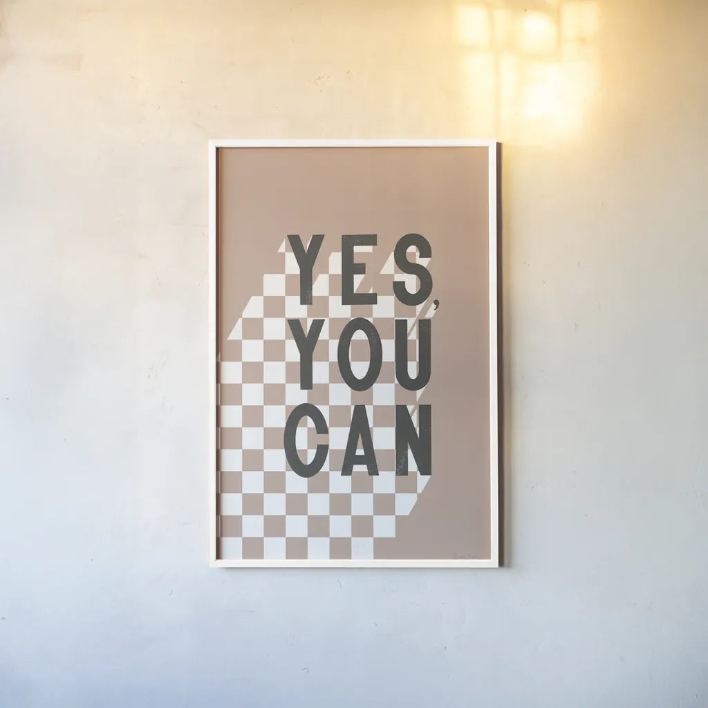 Yes You Can Checkered by Becky Thorns. shown as a paper print in a white frame. Available as a archival giclee rolled canvas, fine art paper, or poster print. SKU 87462h.