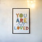 You Are So Loved by Becky Thorns. shown as a paper print in a black flame. Available as a archival giclee rolled canvas, fine art paper, or poster print. SKU 59585h.
