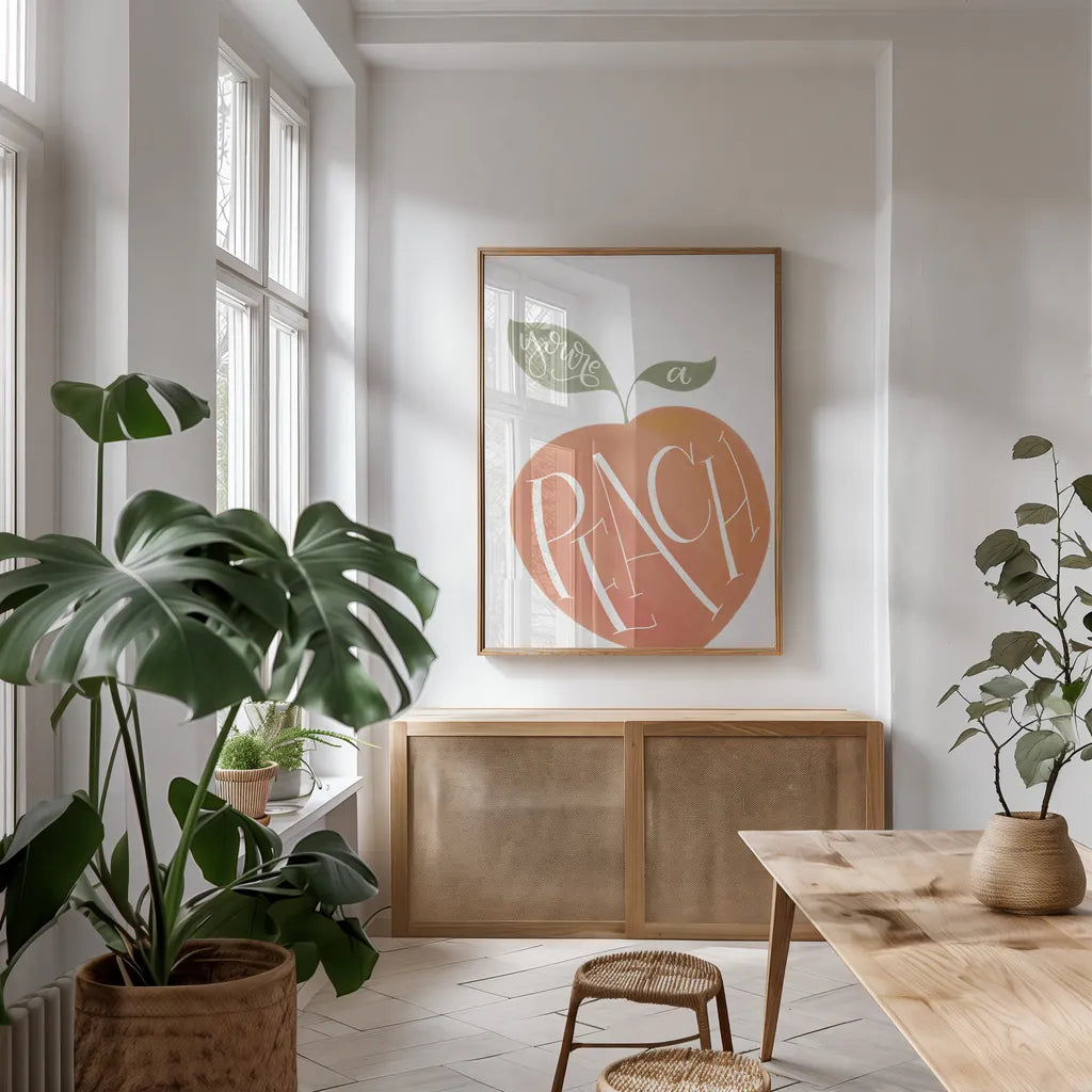 You are a Peach by Becky Thorns. shown as a print in a natural wood frame in a dining room. Available as a archival giclee rolled canvas, fine art paper, or poster print. SKU 61430h.