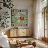 Americana Garden I with border by Beth Grove. Shown in a natural wood frame in a cozy modern living room. Available as an archival giclee rolled canvas, fine art paper, or poster print. SKU 27287a.