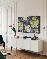 Citrus Charm IV Blue by Beth Grove. shown as a framed stretched canvas in a living room above a console. Available as a archival giclee rolled canvas, fine art paper, or poster print. SKU 82539i.