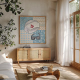 Coastal Baby III by Beth Grove. Shown in a natural wood frame in a cozy modern living room. Available as an archival giclee rolled canvas, fine art paper, or poster print. SKU 29311a.