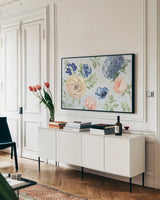 Coastline Botanical I Blue by Beth Grove. shown as a framed stretched canvas in a living room above a console. Available as a archival giclee rolled canvas, fine art paper, or poster print. SKU 58556i.