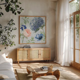 Coastline Botanical III Blue by Beth Grove. Shown in a natural wood frame in a cozy modern living room. Available as an archival giclee rolled canvas, fine art paper, or poster print. SKU 58558a.