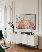 Floral Focus II Blue by Beth Grove. shown as a framed stretched canvas in a living room above a console. Available as a archival giclee rolled canvas, fine art paper, or poster print. SKU 62332i.