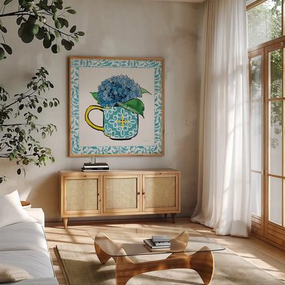 Floral Teacup III Vine Border by Beth Grove. Shown in a natural wood frame in a cozy modern living room. Available as an archival giclee rolled canvas, fine art paper, or poster print. SKU 33846a.