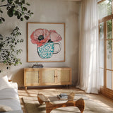 Floral Teacups II by Beth Grove. Shown in a natural wood frame in a cozy modern living room. Available as an archival giclee rolled canvas, fine art paper, or poster print. SKU 32788a.