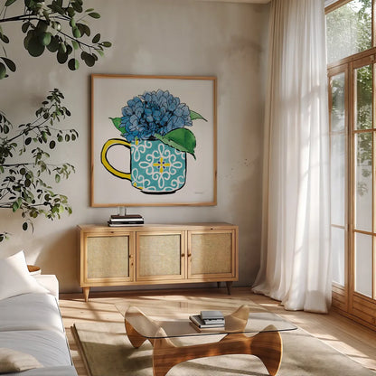 Floral Teacups III by Beth Grove. Shown in a natural wood frame in a cozy modern living room. Available as an archival giclee rolled canvas, fine art paper, or poster print. SKU 32789a.