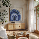 Geode I by Beth Grove. Shown in a natural wood frame in a cozy modern living room. Available as an archival giclee rolled canvas, fine art paper, or poster print. SKU 72200a.