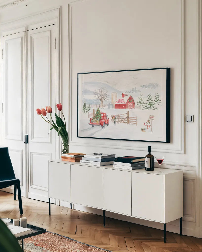 Home For The Holidays I Snowman by Beth Grove. shown as a framed stretched canvas in a living room above a console. Available as a archival giclee rolled canvas, fine art paper, or poster print. SKU 81952i.