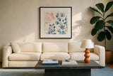 Indigo Petals II by Beth Grove. Displayed in a glass frame with matte in a clean modern living room. Available as an archival giclee rolled canvas, fine art paper, or poster print. SKU 78054a.
