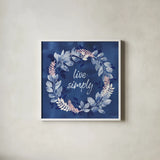 Indigo Petals IV by Beth Grove. Shown in a crisp white glass frame for a clean and minimalist style. Available as an archival giclee rolled canvas, fine art paper, or poster print. SKU 78056a.