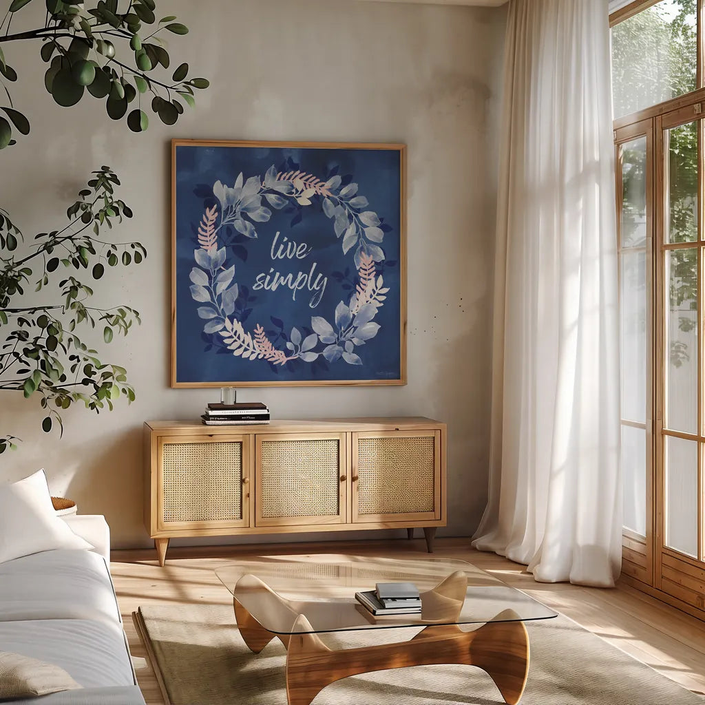 Indigo Petals IV by Beth Grove. Shown in a natural wood frame in a cozy modern living room. Available as an archival giclee rolled canvas, fine art paper, or poster print. SKU 78056a.