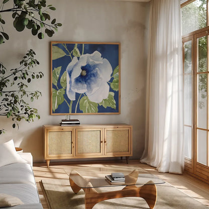Indigo Petals VIII by Beth Grove. Shown in a natural wood frame in a cozy modern living room. Available as an archival giclee rolled canvas, fine art paper, or poster print. SKU 78060a.