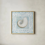 Sandy Shells Blue on Blue Nautilus by Beth Grove. Shown in a natural wood glass frame for a timeless modern aesthetic. Available as an archival giclee rolled canvas, fine art paper, or poster print. SKU 12888a.