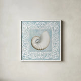 Sandy Shells Blue on Blue Nautilus by Beth Grove. Shown in a crisp white glass frame for a clean and minimalist style. Available as an archival giclee rolled canvas, fine art paper, or poster print. SKU 12888a.