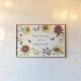 Sunflower Splendor I by Beth Grove. shown as a paper print in a natural frame. Available as a archival giclee rolled canvas, fine art paper, or poster print. SKU 65339i.