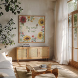 Sunflower Splendor III by Beth Grove. Shown in a natural wood frame in a cozy modern living room. Available as an archival giclee rolled canvas, fine art paper, or poster print. SKU 65341a.