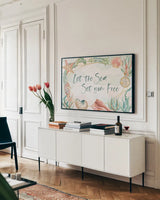 Watercolor Coast I by Beth Grove. shown as a framed stretched canvas in a living room above a console. Available as a archival giclee rolled canvas, fine art paper, or poster print. SKU 47557i.