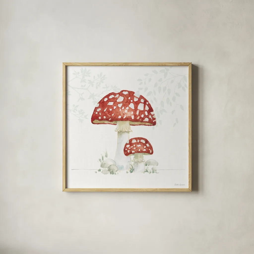 Woodland Love Red Mushroom by Beth Grove. Shown in a natural wood glass frame for a timeless modern aesthetic. Available as an archival giclee rolled canvas, fine art paper, or poster print. SKU 87841a.