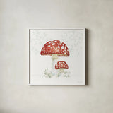 Woodland Love Red Mushroom by Beth Grove. Shown in a crisp white glass frame for a clean and minimalist style. Available as an archival giclee rolled canvas, fine art paper, or poster print. SKU 87841a.