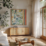 Raining Flowers IV by Candra Boggs. Shown in a natural wood frame in a cozy modern living room. Available as an archival giclee rolled canvas, fine art paper, or poster print. SKU 22634a.