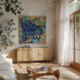 Rose I by Candra Boggs. Shown in a natural wood frame in a cozy modern living room. Available as an archival giclee rolled canvas, fine art paper, or poster print. SKU 20434a.
