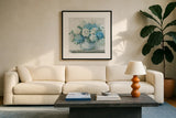 Blue Hydrangea Cottage Crop by Carol Rowan. Displayed in a glass frame with matte in a clean modern living room. Available as an archival giclee rolled canvas, fine art paper, or poster print. SKU 47410a.