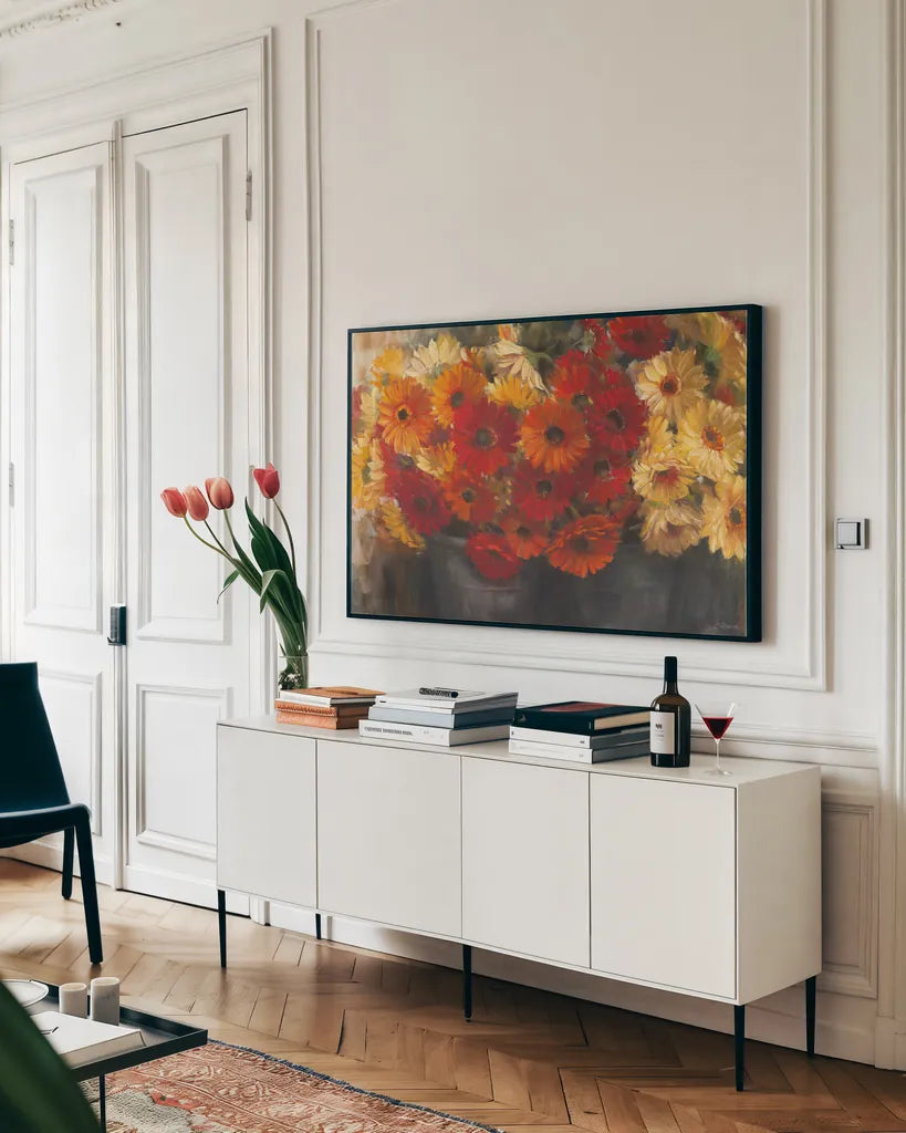 Chelsea Gerberas Grey by Carol Rowan. shown as a framed stretched canvas in a living room above a console. Available as a archival giclee rolled canvas, fine art paper, or poster print. SKU 41566i.