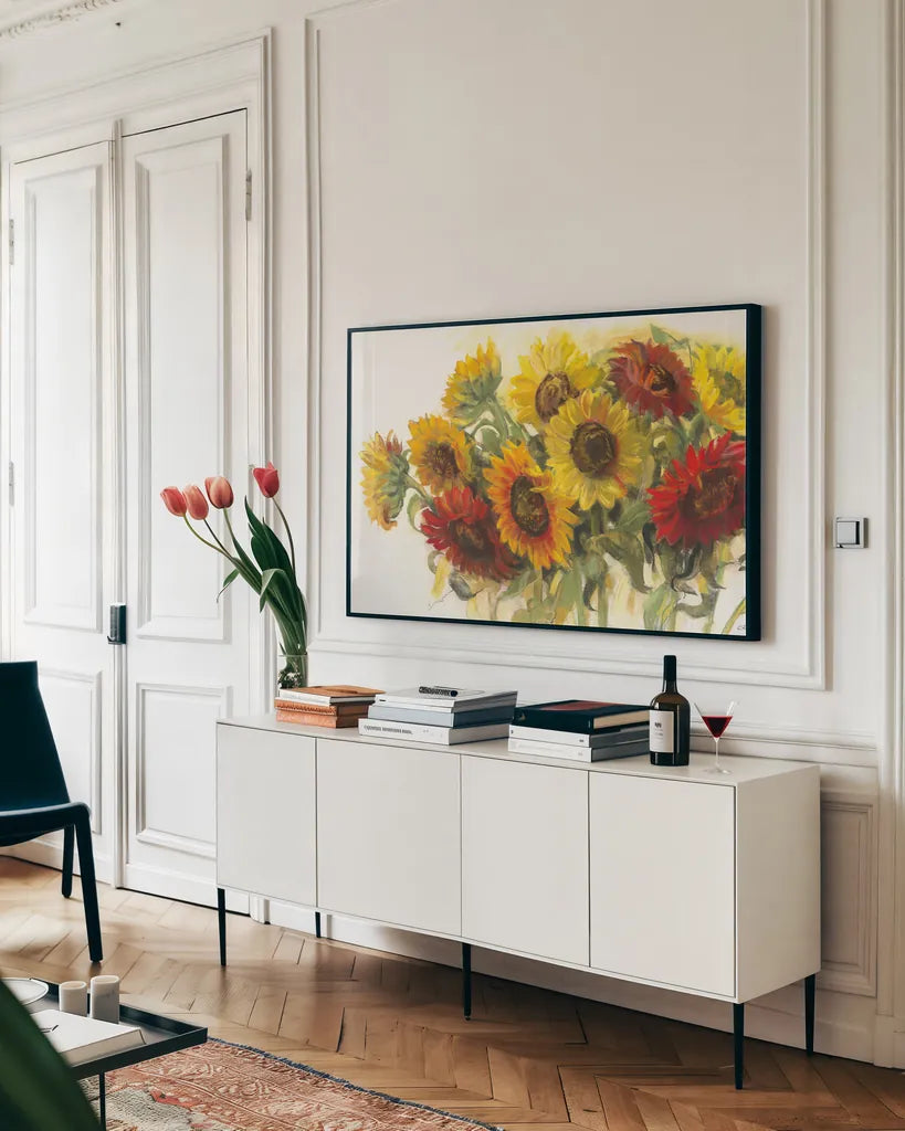 Gathering Sunflowers on White by Carol Rowan. shown as a framed stretched canvas in a living room above a console. Available as a archival giclee rolled canvas, fine art paper, or poster print. SKU 31391i.