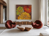 Gerbera Glow I Spice by Carol Rowan. Shown as extra-large giant wall art in a modern living room. Available as an archival giclee rolled canvas, fine art paper, or poster print. SKU 41934a.