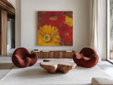 Gerbera Glow II Spice by Carol Rowan. Shown as extra-large giant wall art in a modern living room. Available as an archival giclee rolled canvas, fine art paper, or poster print. SKU 41937a.