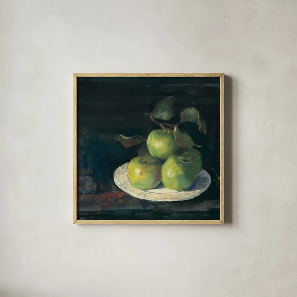 Green Apples II by Carol Rowan. Shown in a natural wood glass frame for a timeless modern aesthetic. Available as an archival giclee rolled canvas, fine art paper, or poster print. SKU 42419a.