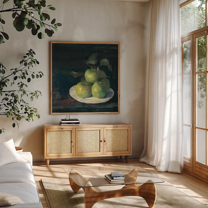 Green Apples II by Carol Rowan. Shown in a natural wood frame in a cozy modern living room. Available as an archival giclee rolled canvas, fine art paper, or poster print. SKU 42419a.