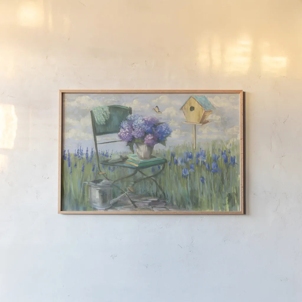 Green Chair with Hydrangea by Carol Rowan. shown as a paper print in a natural frame. Available as a archival giclee rolled canvas, fine art paper, or poster print. SKU 42299i.