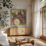 Hydrangea Delight I by Carol Rowan. Shown in a natural wood frame in a cozy modern living room. Available as an archival giclee rolled canvas, fine art paper, or poster print. SKU 2414a.