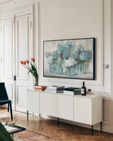 Hydrangeas in Glass Jars Blue Crop by Carol Rowan. shown as a framed stretched canvas in a living room above a console. Available as a archival giclee rolled canvas, fine art paper, or poster print. SKU 46617i.