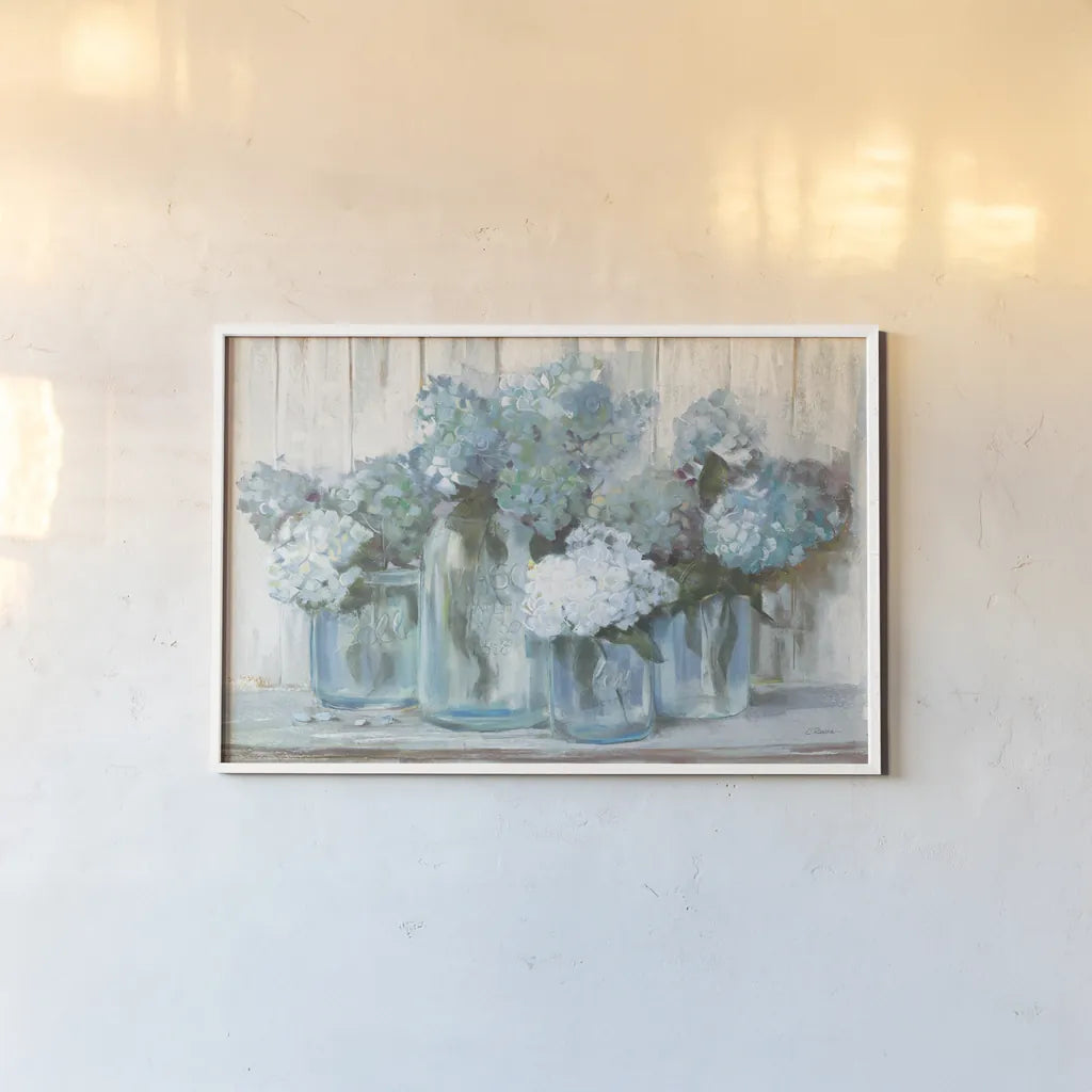 Hydrangeas in Glass Jars Blue Crop by Carol Rowan. shown as a paper print in a white frame. Available as a archival giclee rolled canvas, fine art paper, or poster print. SKU 46617i.