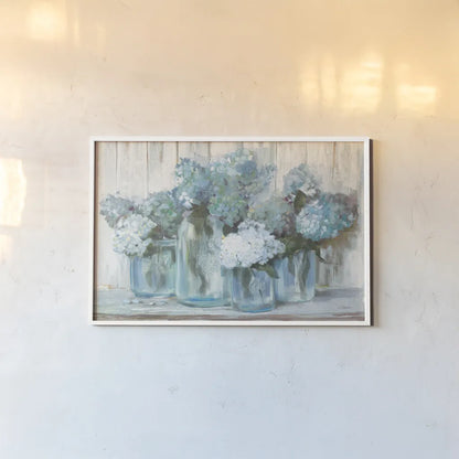Hydrangeas in Glass Jars Blue Crop by Carol Rowan. shown as a paper print in a white frame. Available as a archival giclee rolled canvas, fine art paper, or poster print. SKU 46617i.