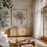 Ironstone Bouquet I Bright by Carol Rowan. Shown in a natural wood frame in a cozy modern living room. Available as an archival giclee rolled canvas, fine art paper, or poster print. SKU 46642a.