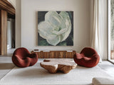 Magnolia III Sage by Carol Rowan. Shown as extra-large giant wall art in a modern living room. Available as an archival giclee rolled canvas, fine art paper, or poster print. SKU 47396a.