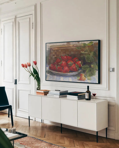 Plate of Strawberries by Carol Rowan. shown as a framed stretched canvas in a living room above a console. Available as a archival giclee rolled canvas, fine art paper, or poster print. SKU 26314i.