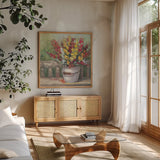 Snapdragon Bouquet by Carol Rowan. Shown in a natural wood frame in a cozy modern living room. Available as an archival giclee rolled canvas, fine art paper, or poster print. SKU 65548a.