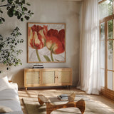 Spring Tulips Red I by Carol Rowan. Shown in a natural wood frame in a cozy modern living room. Available as an archival giclee rolled canvas, fine art paper, or poster print. SKU 42412a.