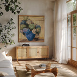 Summer Hydrangea Blue Pot by Carol Rowan. Shown in a natural wood frame in a cozy modern living room. Available as an archival giclee rolled canvas, fine art paper, or poster print. SKU 100001a.